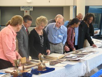 people looking at memorabilia