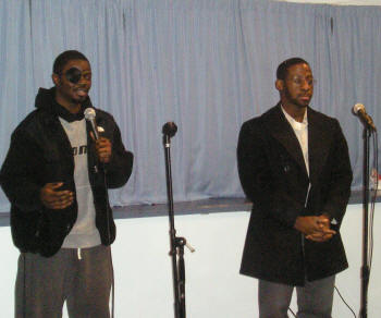 two young men at microphones