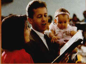 A family singing a hymn