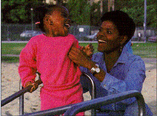 a mother playing with her daughter