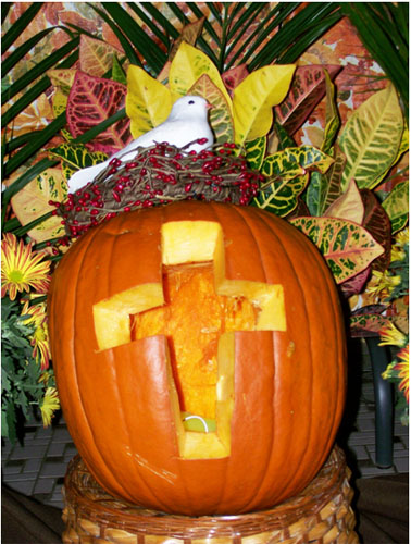 a cross-carved pumpkin
