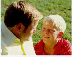 a man talking to a boy