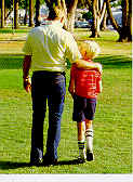 a man and a boy walking together