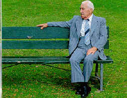 elderly man sitting on a bench