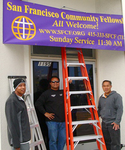 putting up the congregation's banner at their building