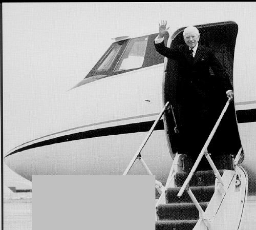 Herbert Amstrong waving from the entrance of the church-owned jet